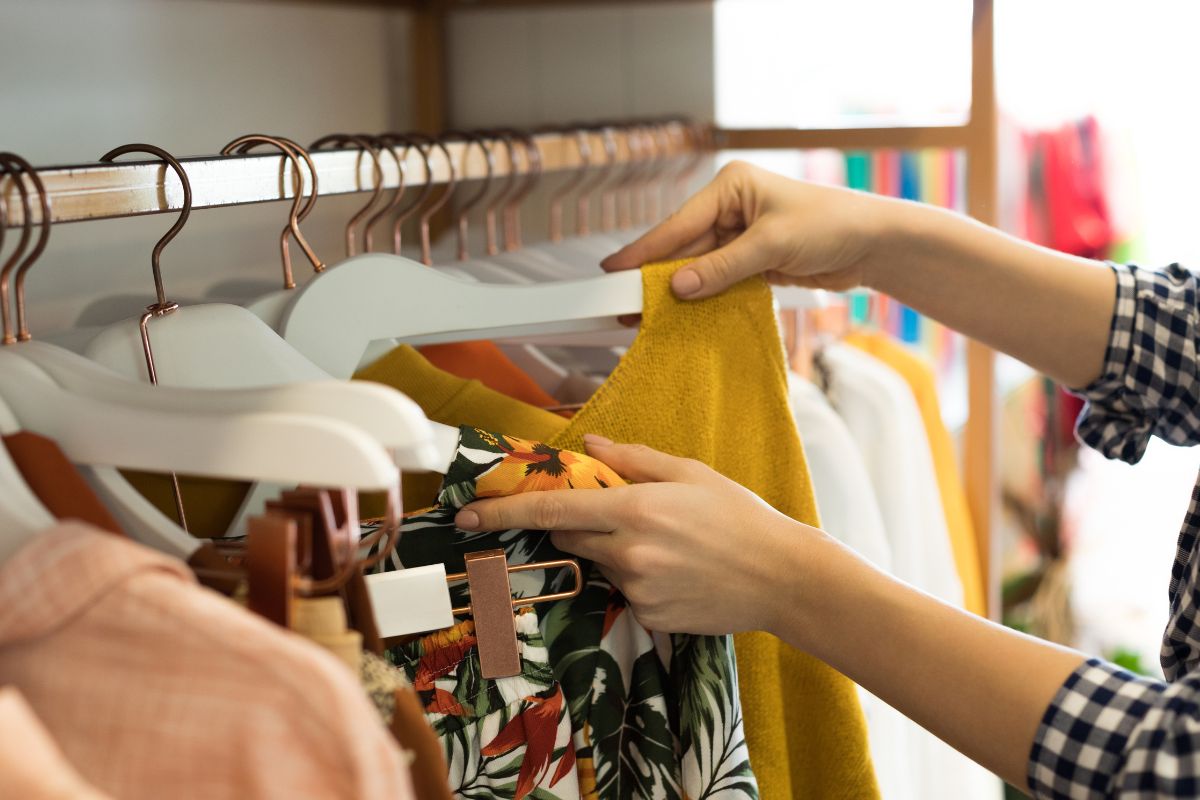 Picture of a woman's hand shopping clothes.
