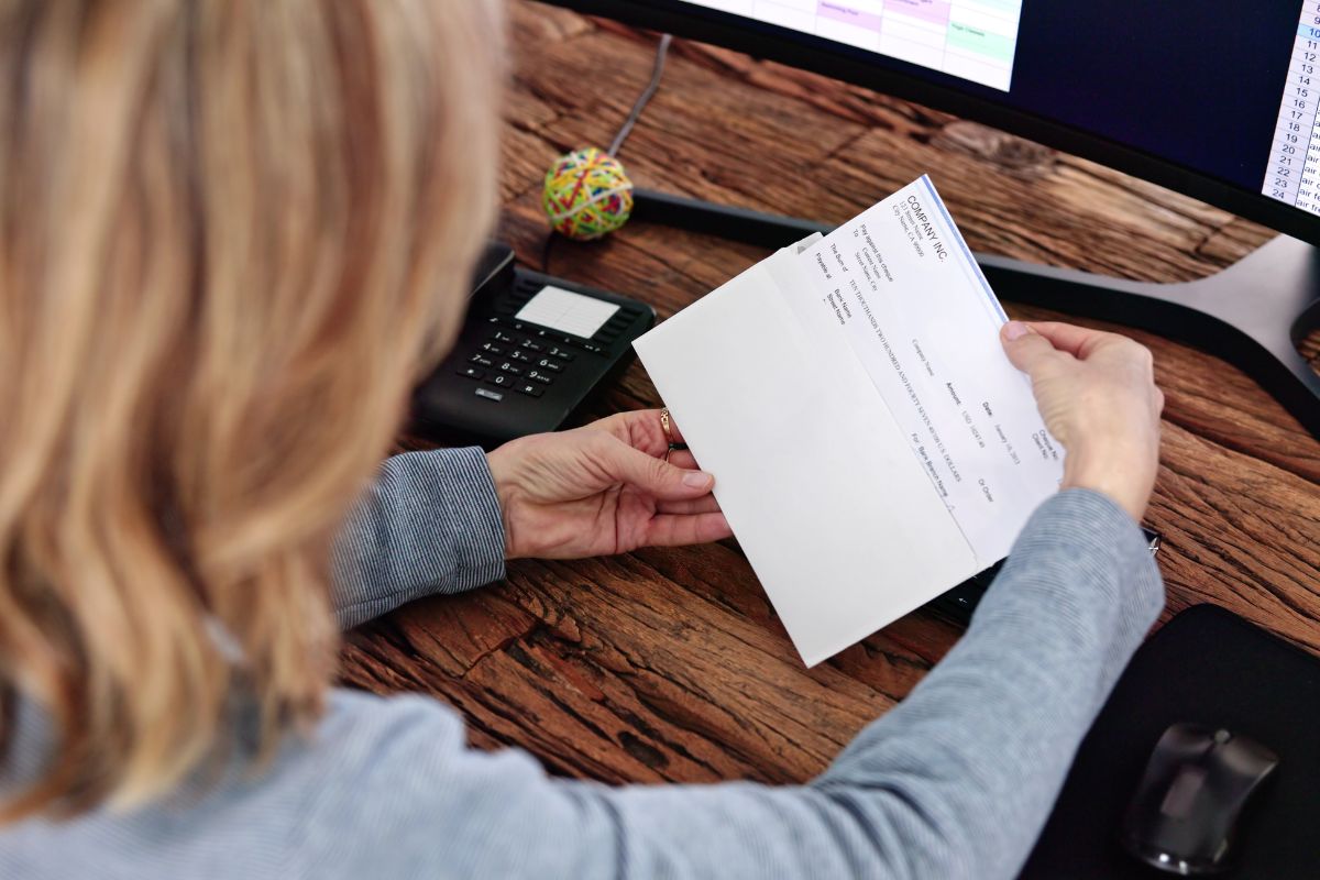 A woman checking her paycheck.