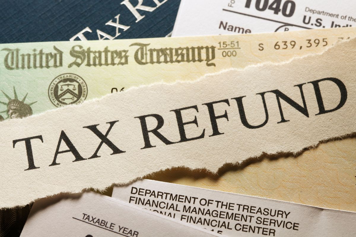 Photo of tax refund and papers.