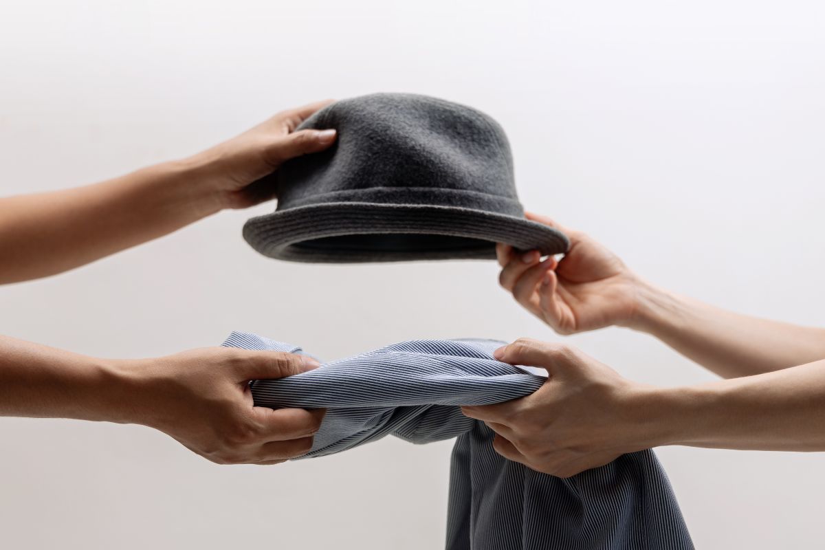 Picture of women's hands and swapping items.