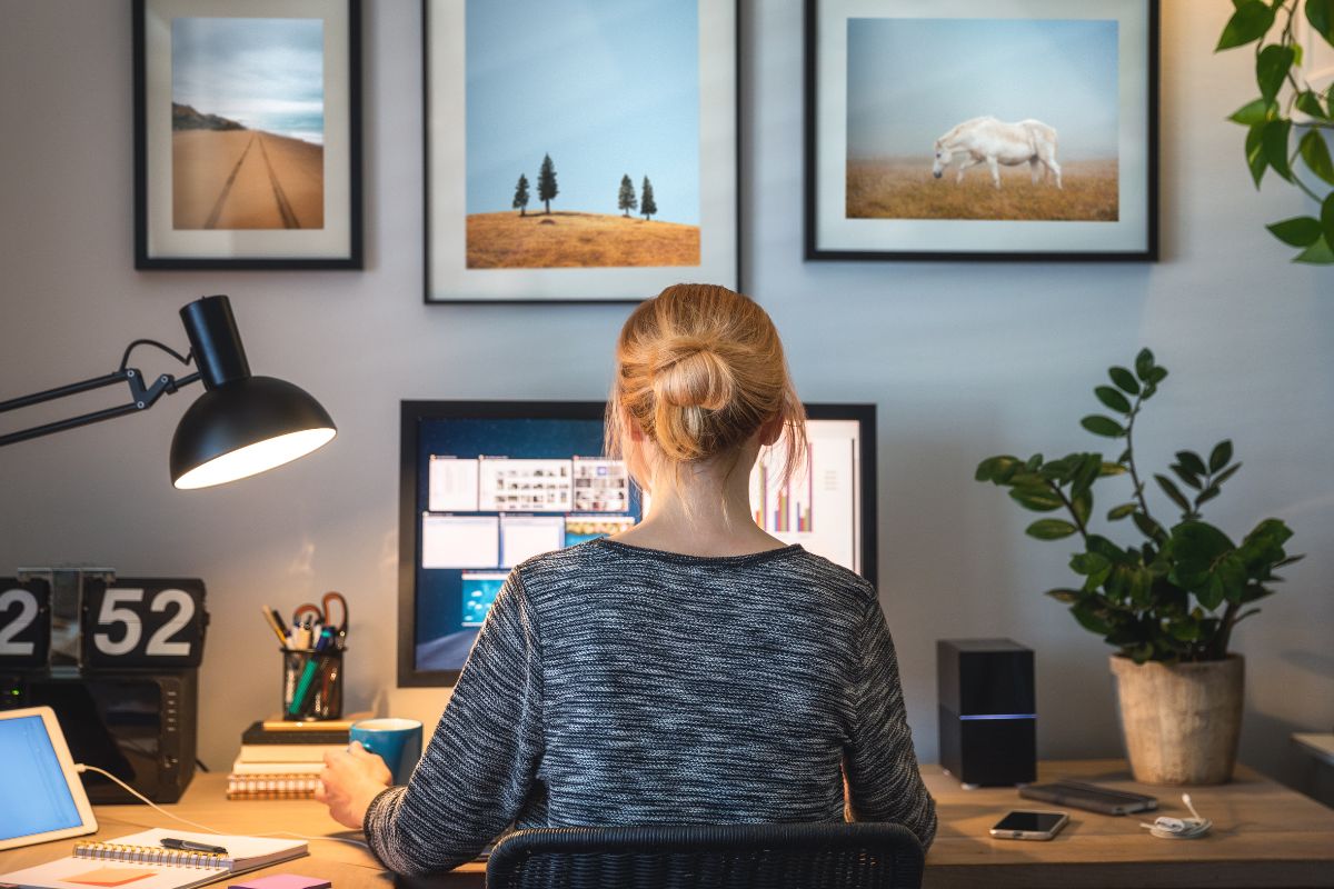 Image shows a woman working from home.