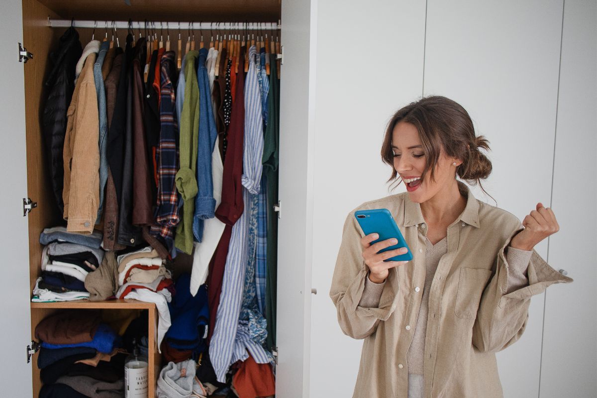 Picture of a woman selling her unused clothes online.