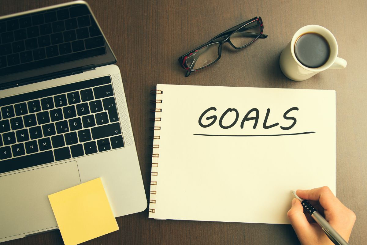 Picture of a woman's hand setting goals.