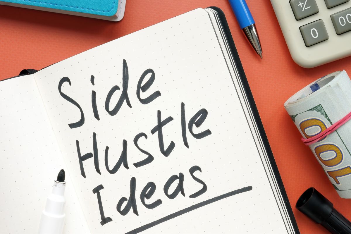 The image shows a notebook with side hustles ideas wording.