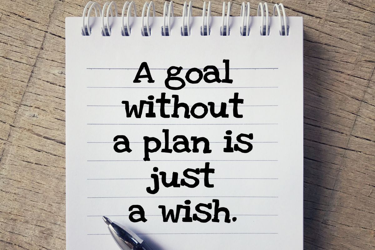 The image shows a notebook with money affirmation.