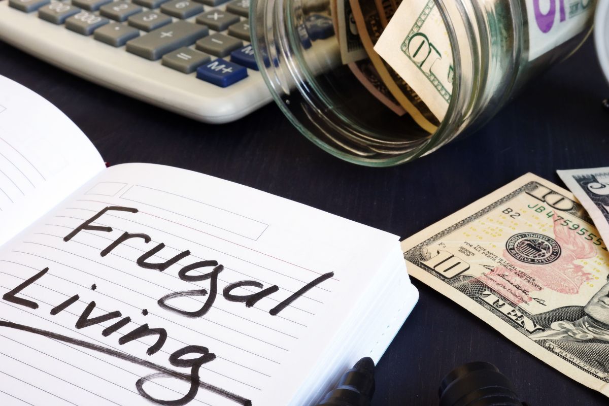 Image of a notebook with frugal living wording.