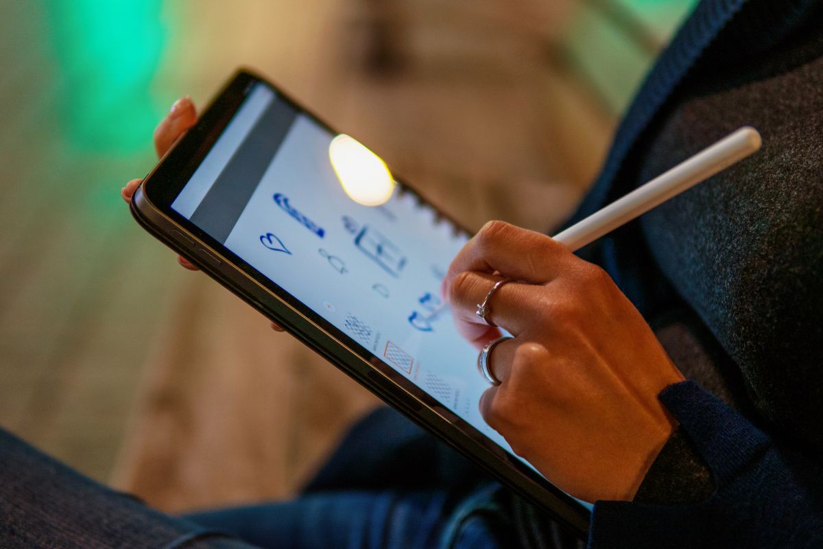 Picture of a woman's hand creating digital art.
