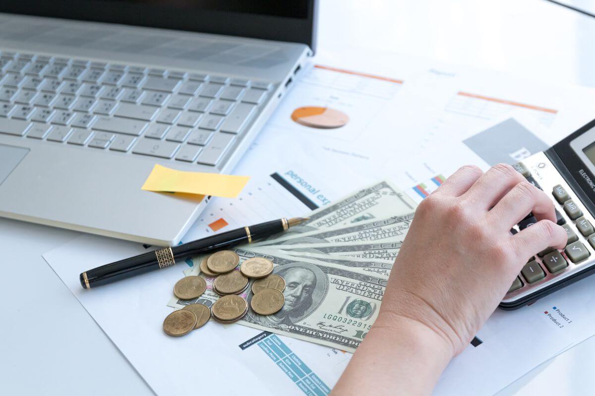 Picture of a woman calculating her finances.