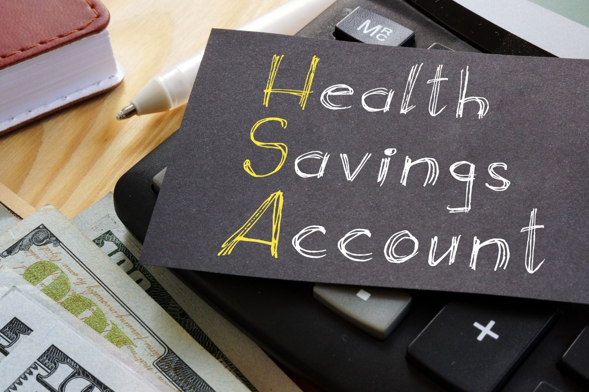 Image of money and paper with a health savings account.