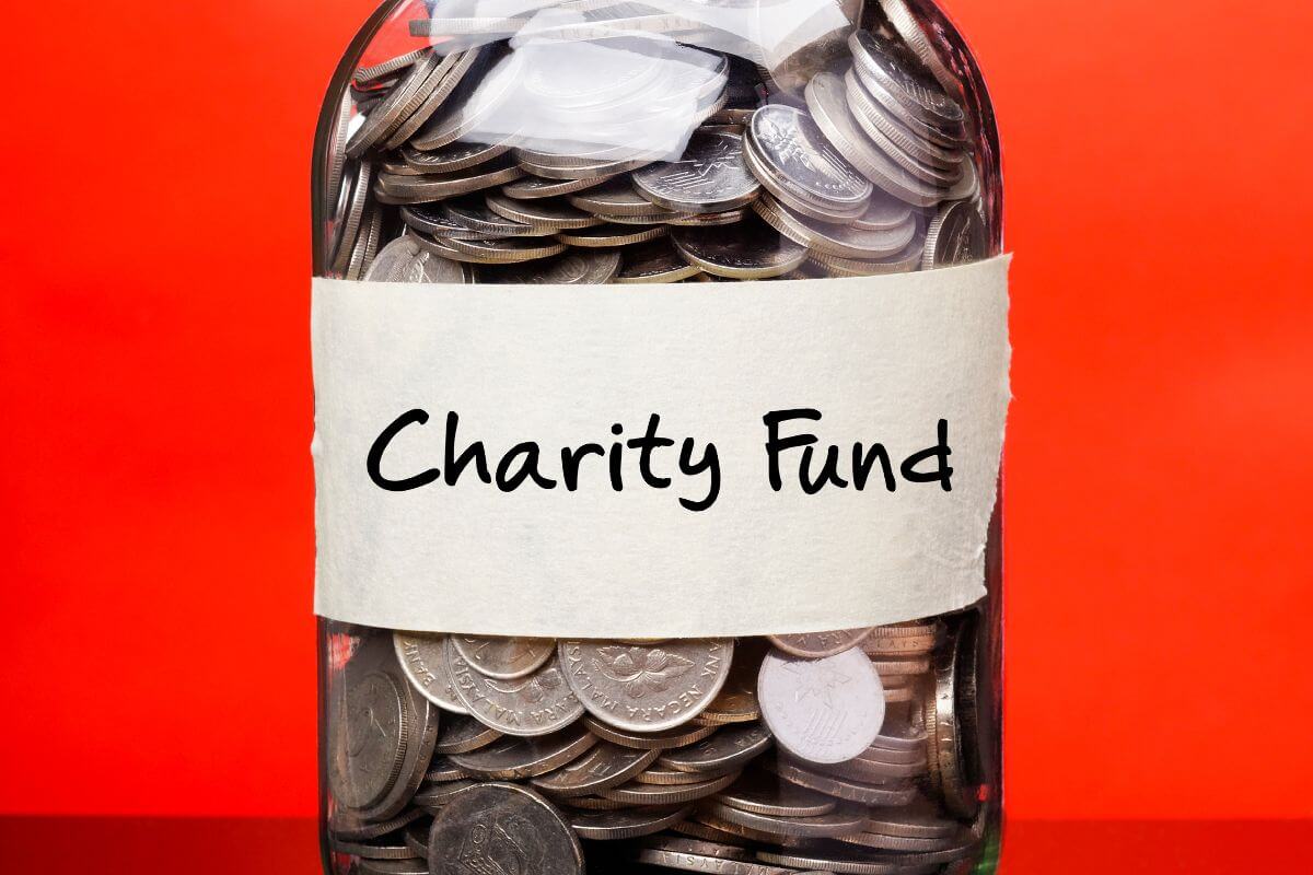 The image shows a jar filled with coins and with notes referring to increase contributions to charitable giving which is an opportunity to use your success to benefit others.