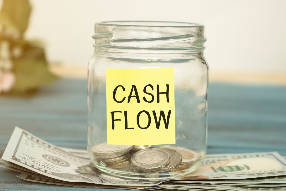 Image of money and a jar with cash flow wording.