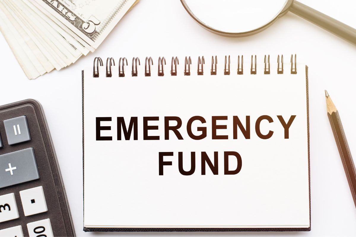 The photo shows a notebook with emergency fund wording.