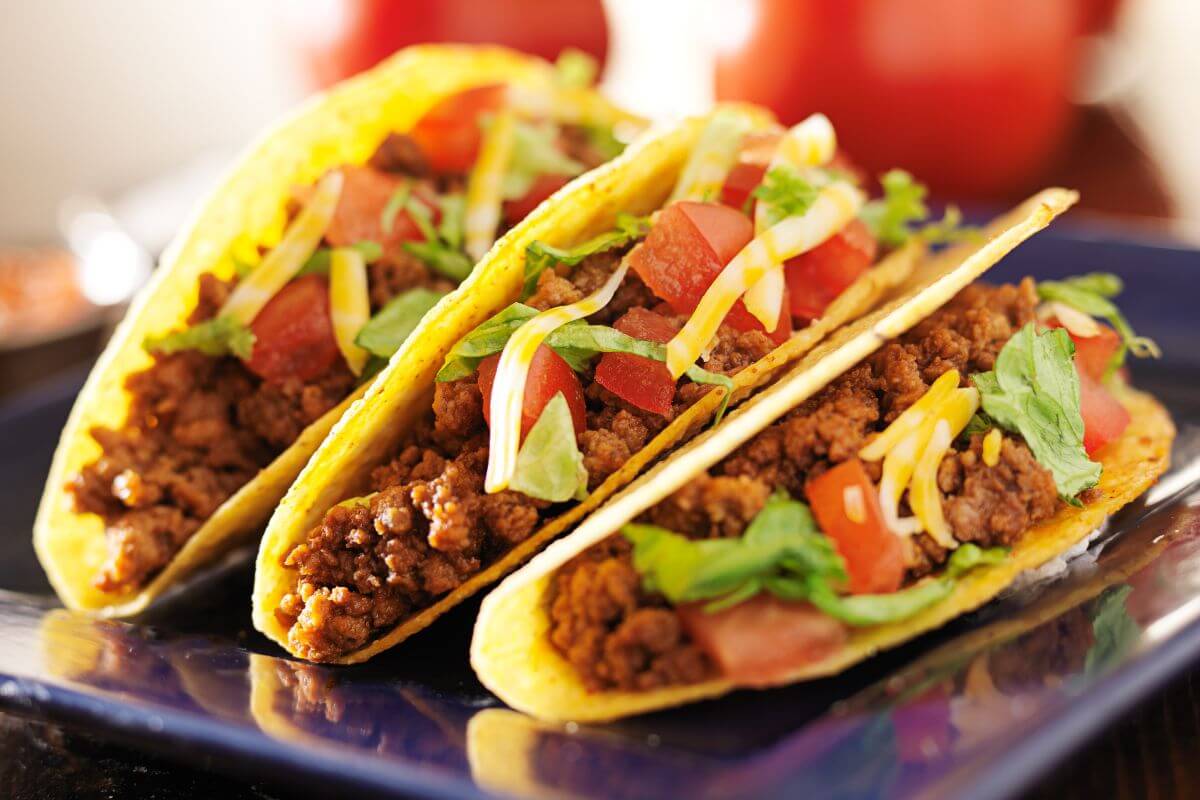 The picture of tacos with grilled beef flavor and tomatoes which is a quick dinner or a fun family meal that keeps costs low while pleasing everyone at the table.thsa