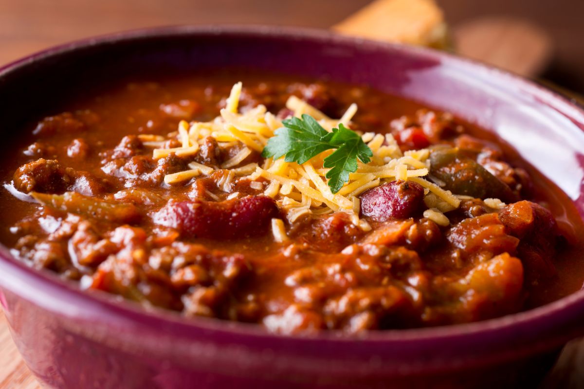 Picture of chili with cheese in a bowl.