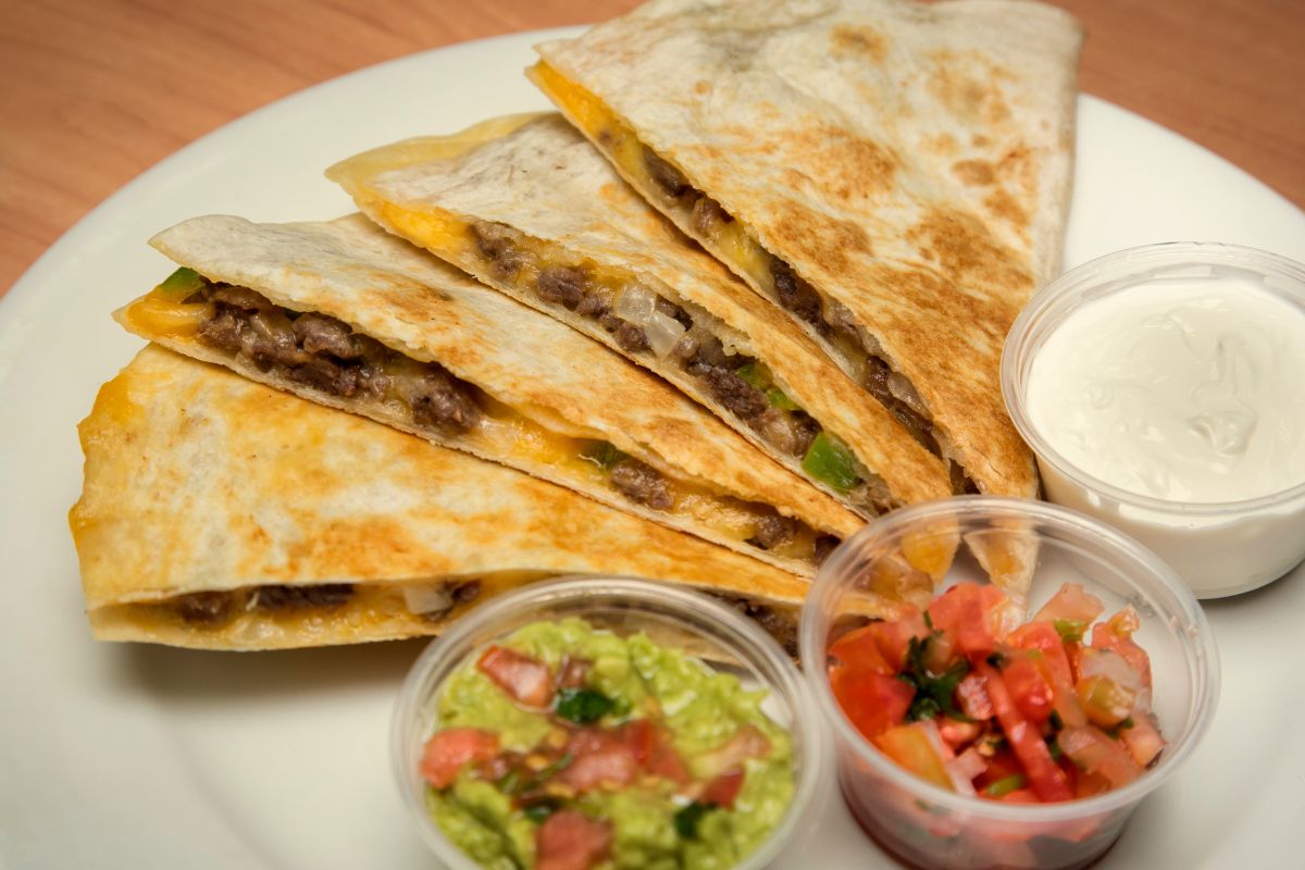 The photo shows Quesadillas with dips on a plate.