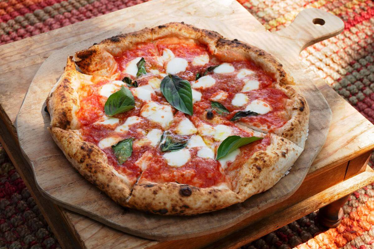 The image of a wooden stand with pizza on top which perfect for stretching your grocery budget.