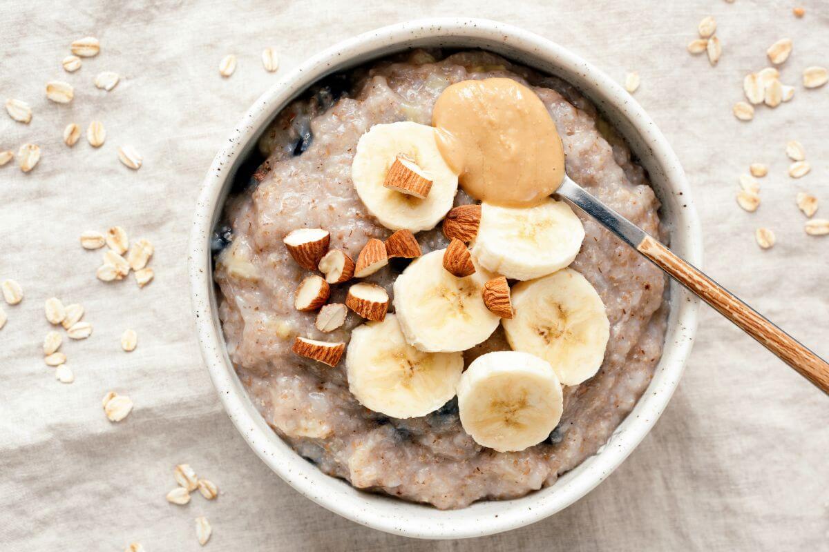 The picture tells about an oatmeal with banana and a scoop of peanut butter which keeps grocery costs low.