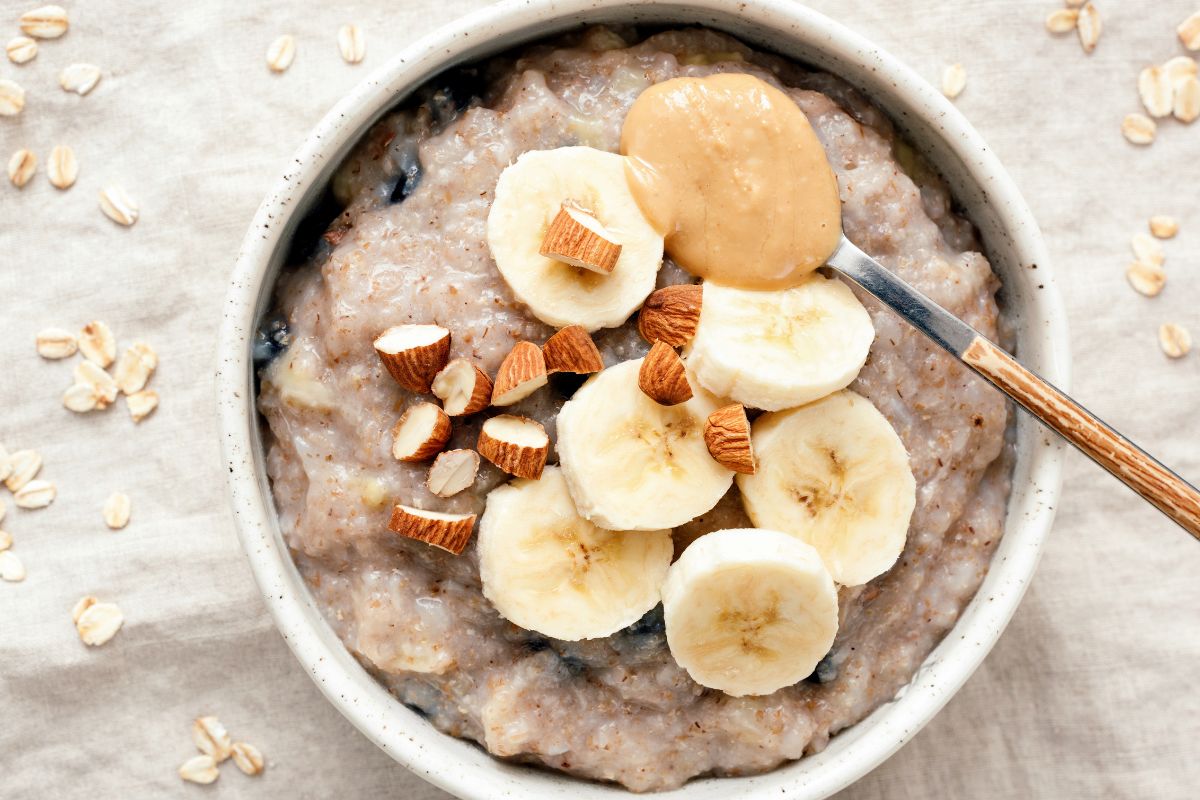 Picture of oatmeal with banana and almonds in a bowl.