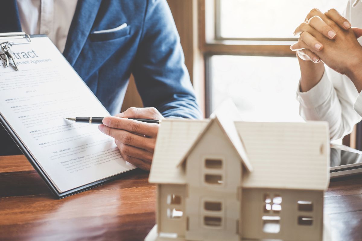 The picture shows a man managing real estate properties.