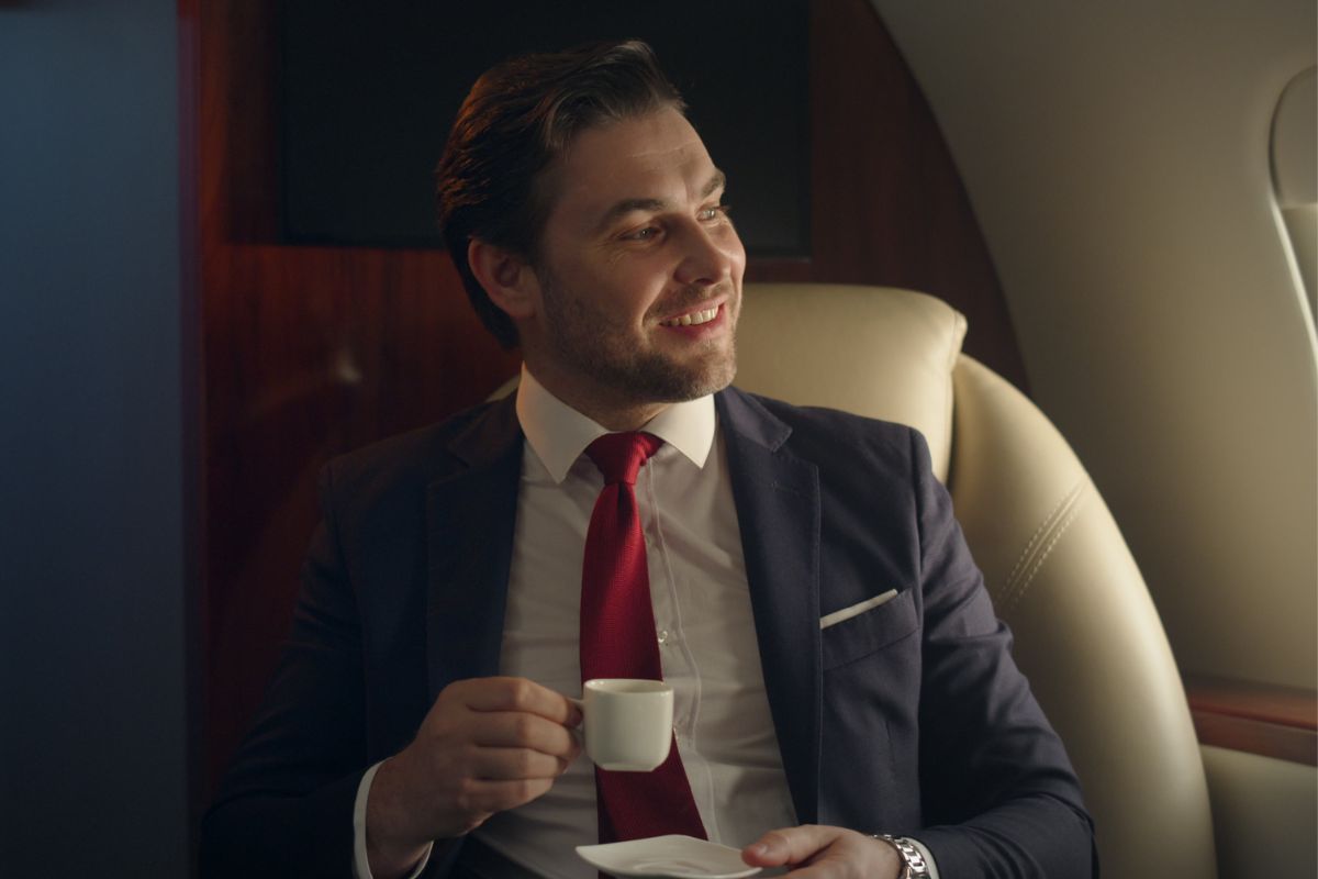 Picture of a millionaire man having a coffee.