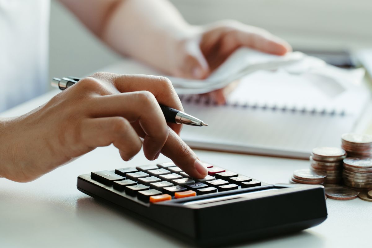Photo of a woman's hand budgeting.