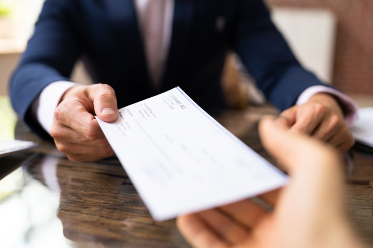 A man receiving a paycheck.