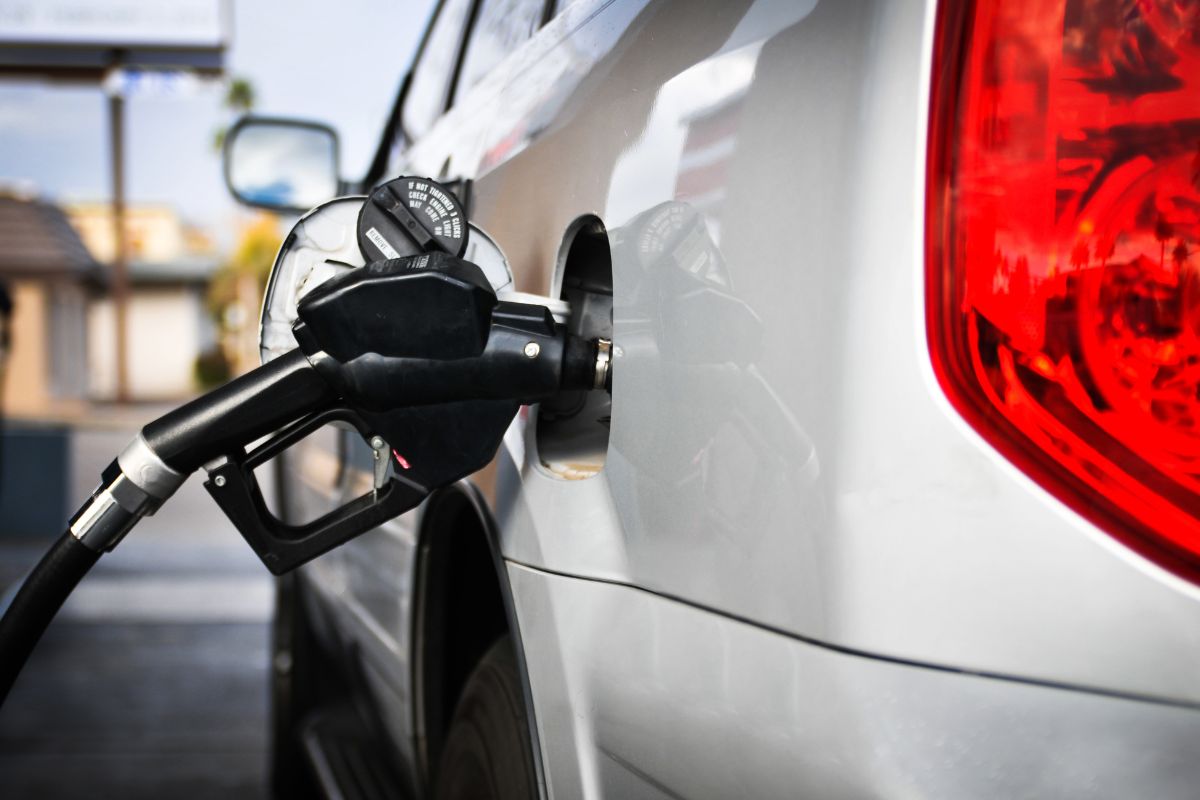 Photo of a car refilling a gas.