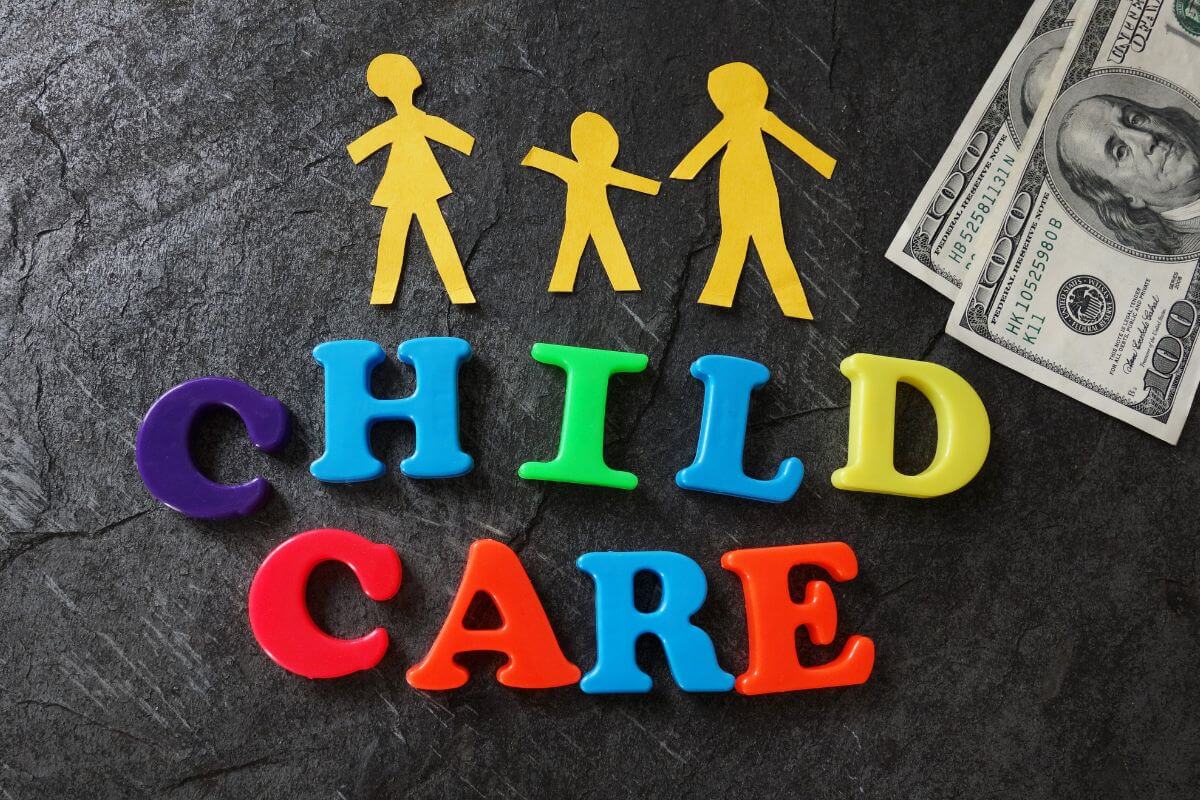 The picture tells about dollar bills, colorful letters, and paper-cut family figure indicating that retirees no longer face the hefty costs of childcare and giving your budget some breathing.