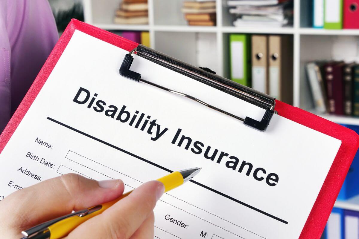 The picture tells about files on the shelve and a girl's hand pointing to the clipboard with notes of a pen indicating that retired individuals no longer need disability insurance and help stretch their retirement funds.