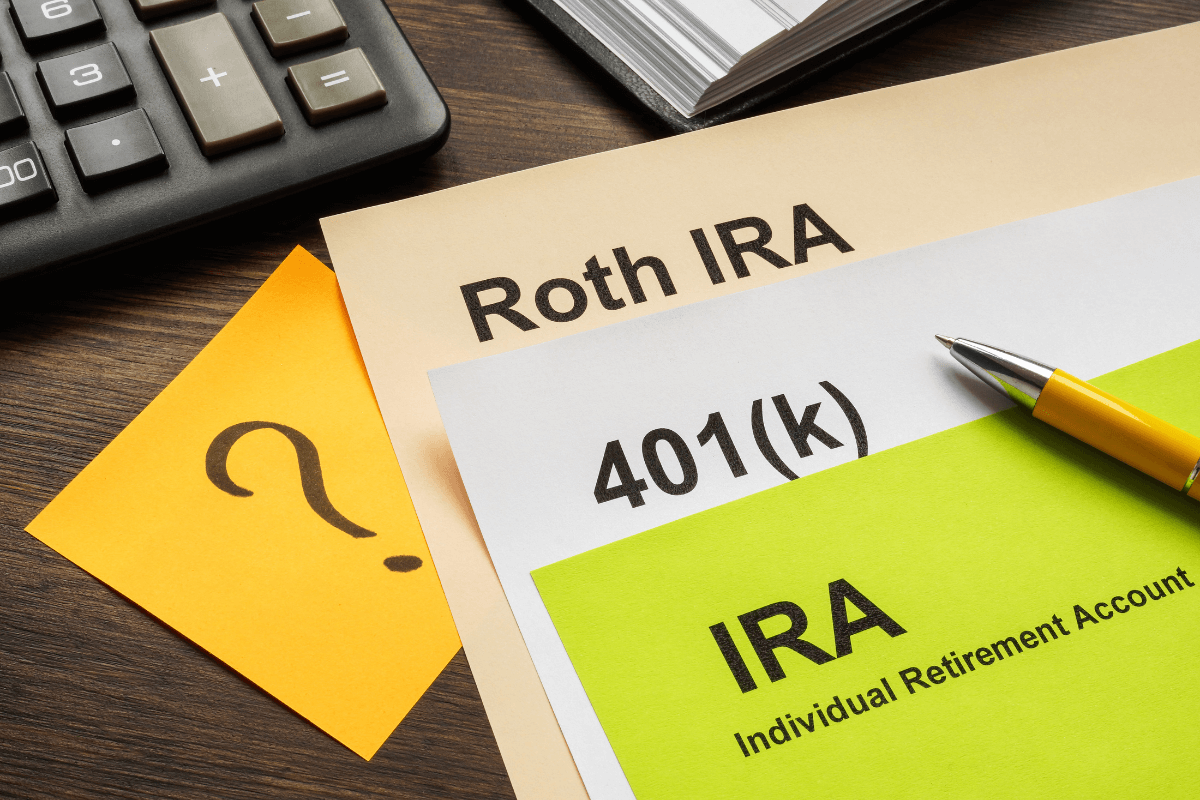 The picture of a calculator, a notebook, a pen, and papers with notes on the table indicate to retirees no need to add on retirement account contributions and give their budget a break.