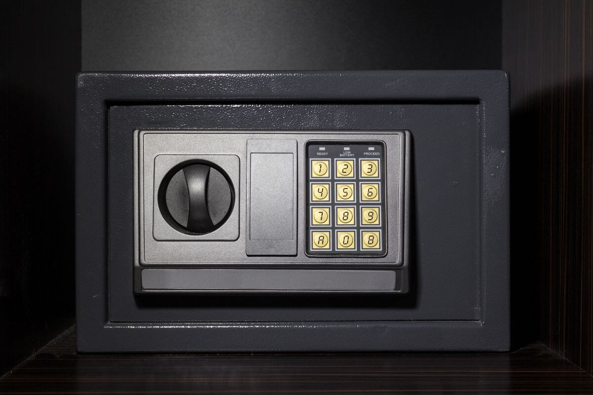 The picture tells about a box with a number button which means packing a small safe or lockbox ensures you can grab what matters most quickly when in a hurry.