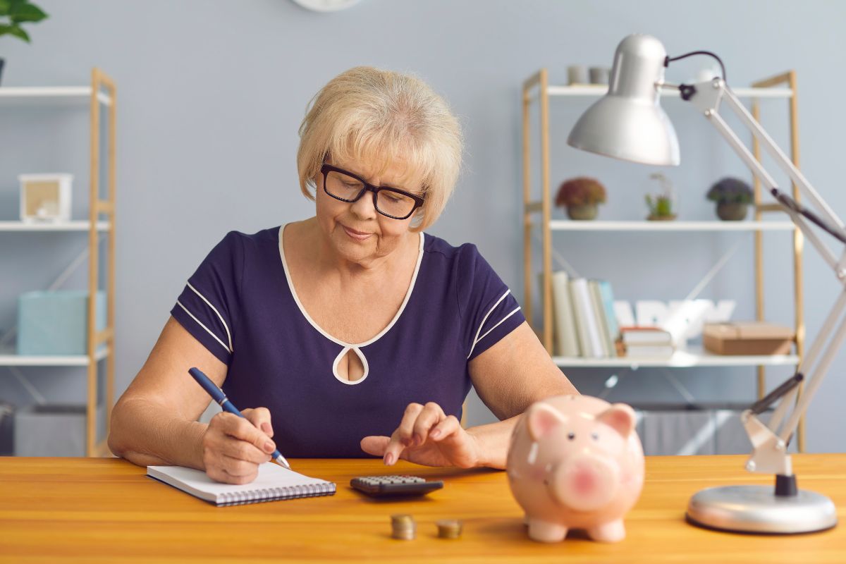 A senior woman reducing her expenses.