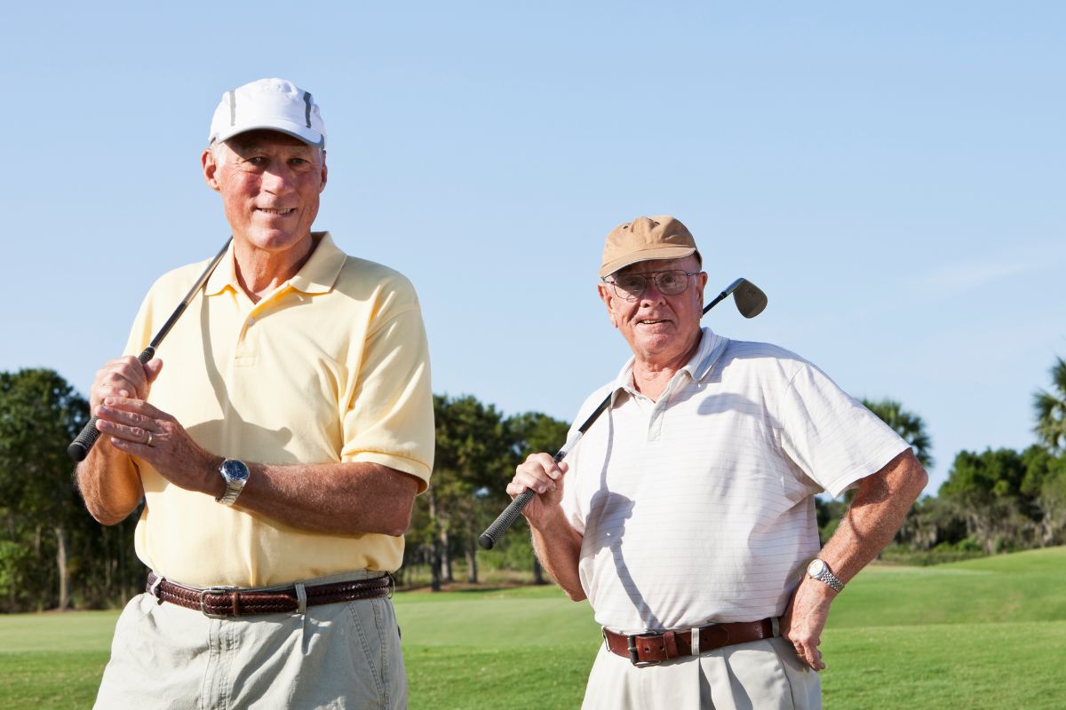 Senior men playing golf.