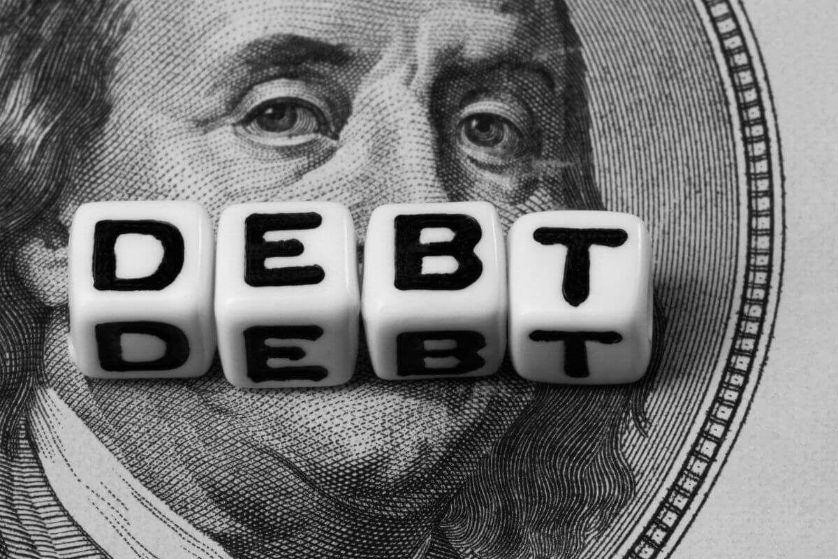 The image shows a dollar bill icon and white dices with letter referring to good debt helps you grow your wealth which only works to your advantage by building your net worth or generating income.