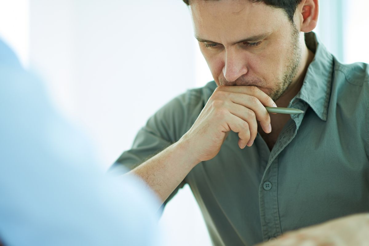 Photo of a man making a decision.