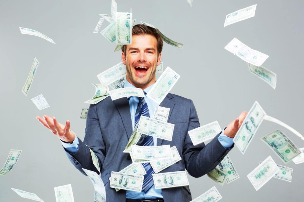The photo shows a man enjoying the money falling to him indicating to doesn't trust get-rich-quickly schemes often lead to big losses and there's no shortcut to financial independence.