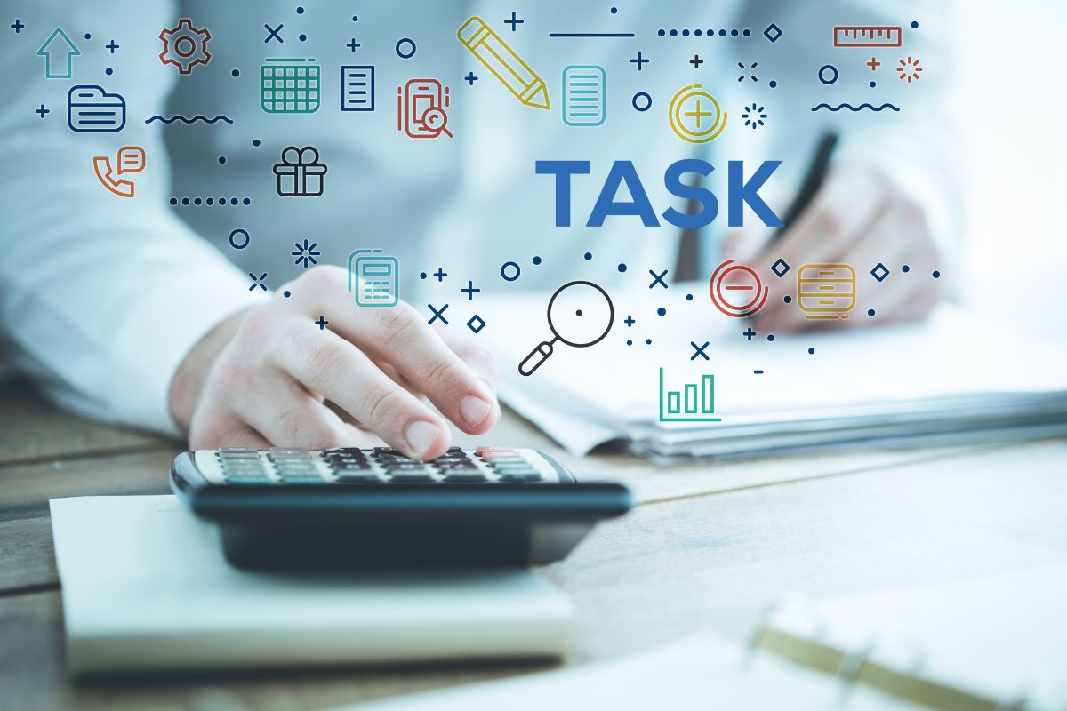 Image of a man's hand doing his task.