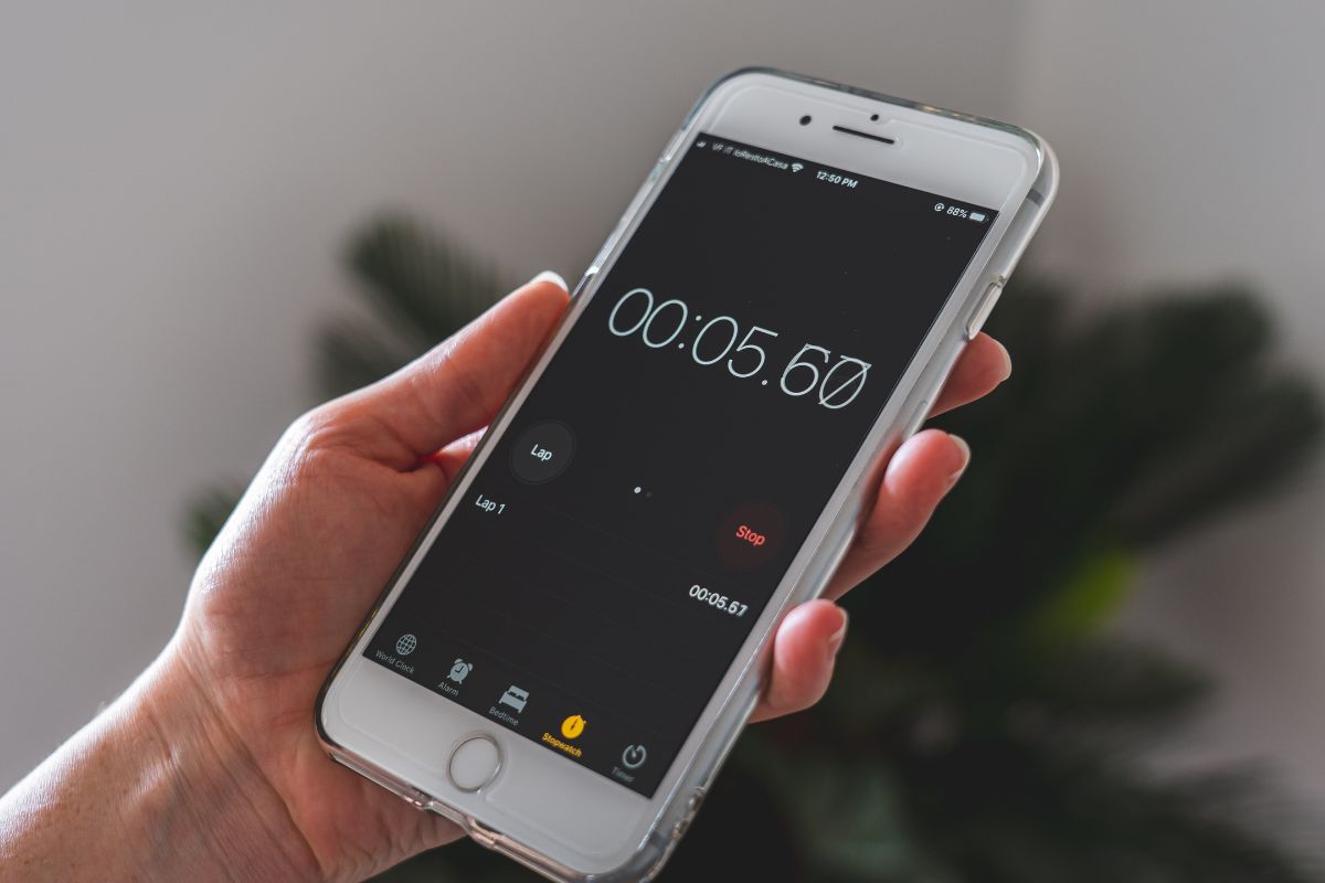 A woman's hand using a timer.