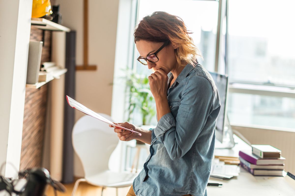 The photo shows a woman reviewing her plan.