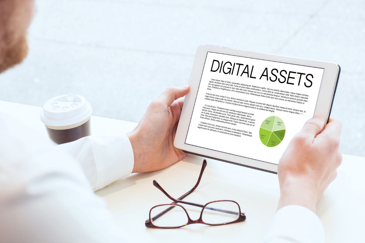 Picture of a man overlooking his digital assets.