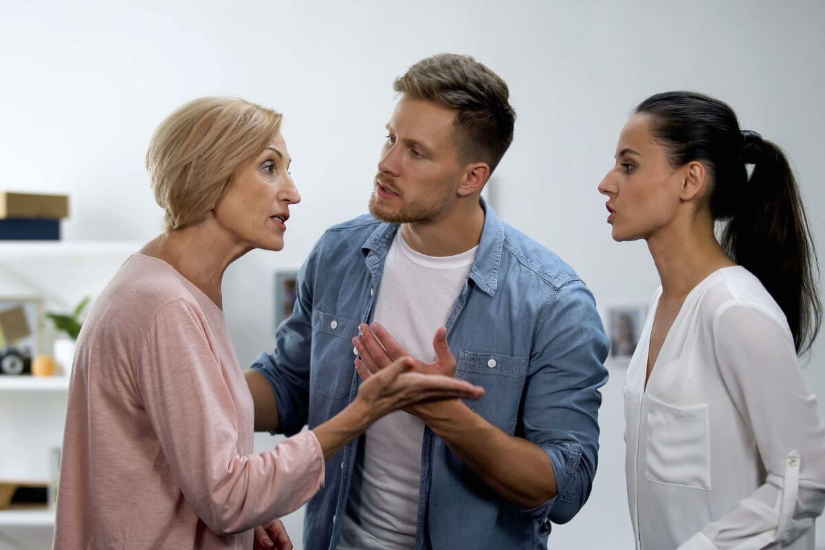 The photo shows a quarrel between a mother and her daughter-in-law and his son in between of them which means that leaving unresolved family conflicts can worsen after you're gone, addressing issues now helps prevent future disagreements.