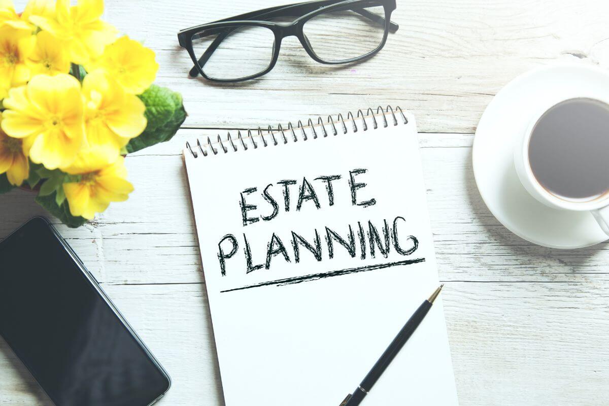 The picture tells about a flower, an eyeglass, a phone, coffee, a pen, and a notebook with notes referring to the most needed steps to start estate planning and take control of your legacy with a plan that reflects your values and priorities.