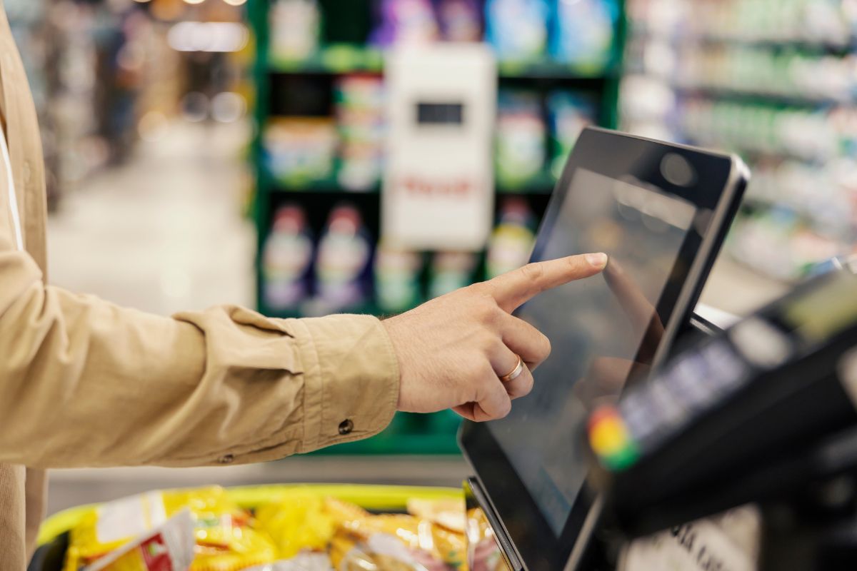 Image of a woman purchasing at a store.