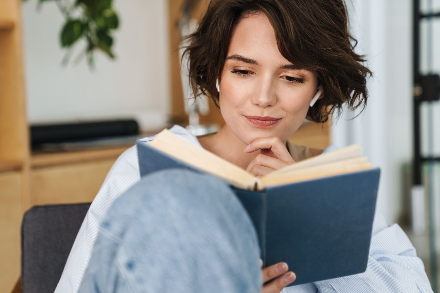 Image of a woman reading a book.