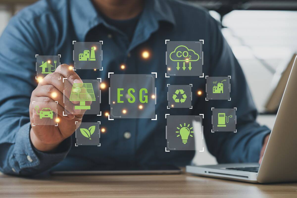 The picture tells about a man using a laptop with visual icons indicating that research companies with strong ESG practices, and supporting them can align your investments with your values.