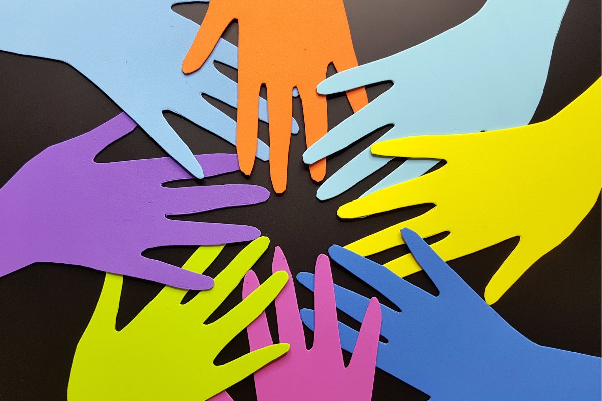 The photo shows a paper hand figure.