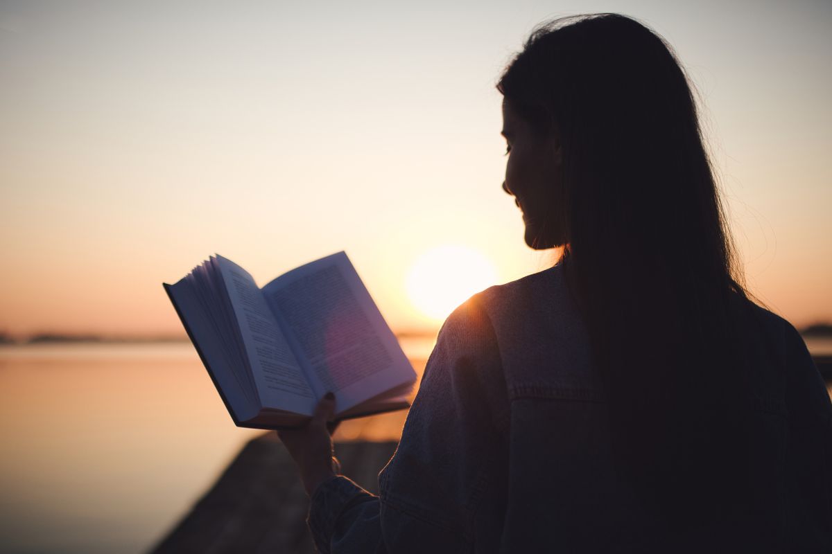 Image of a woman reading a book.