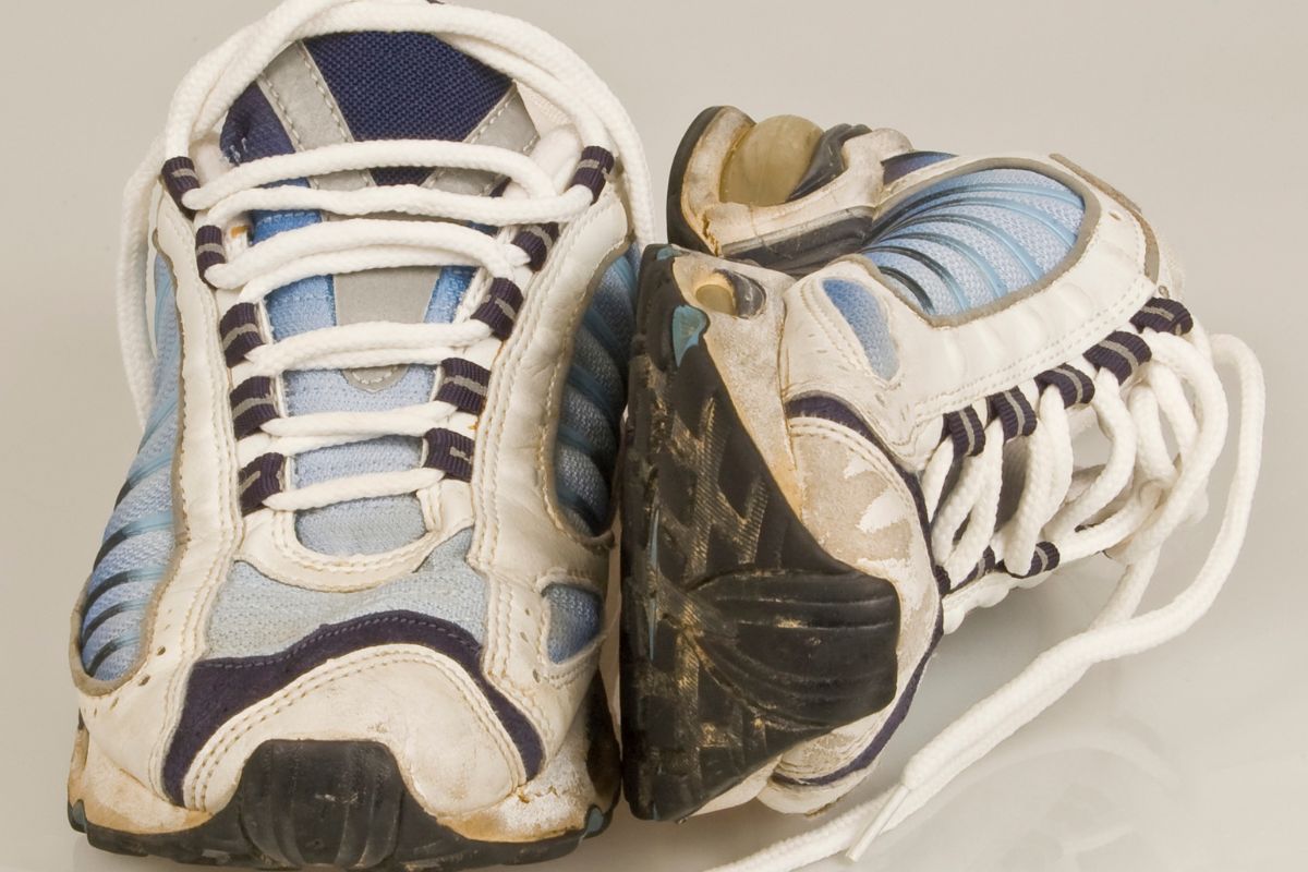 The image shows worn-out shoes.