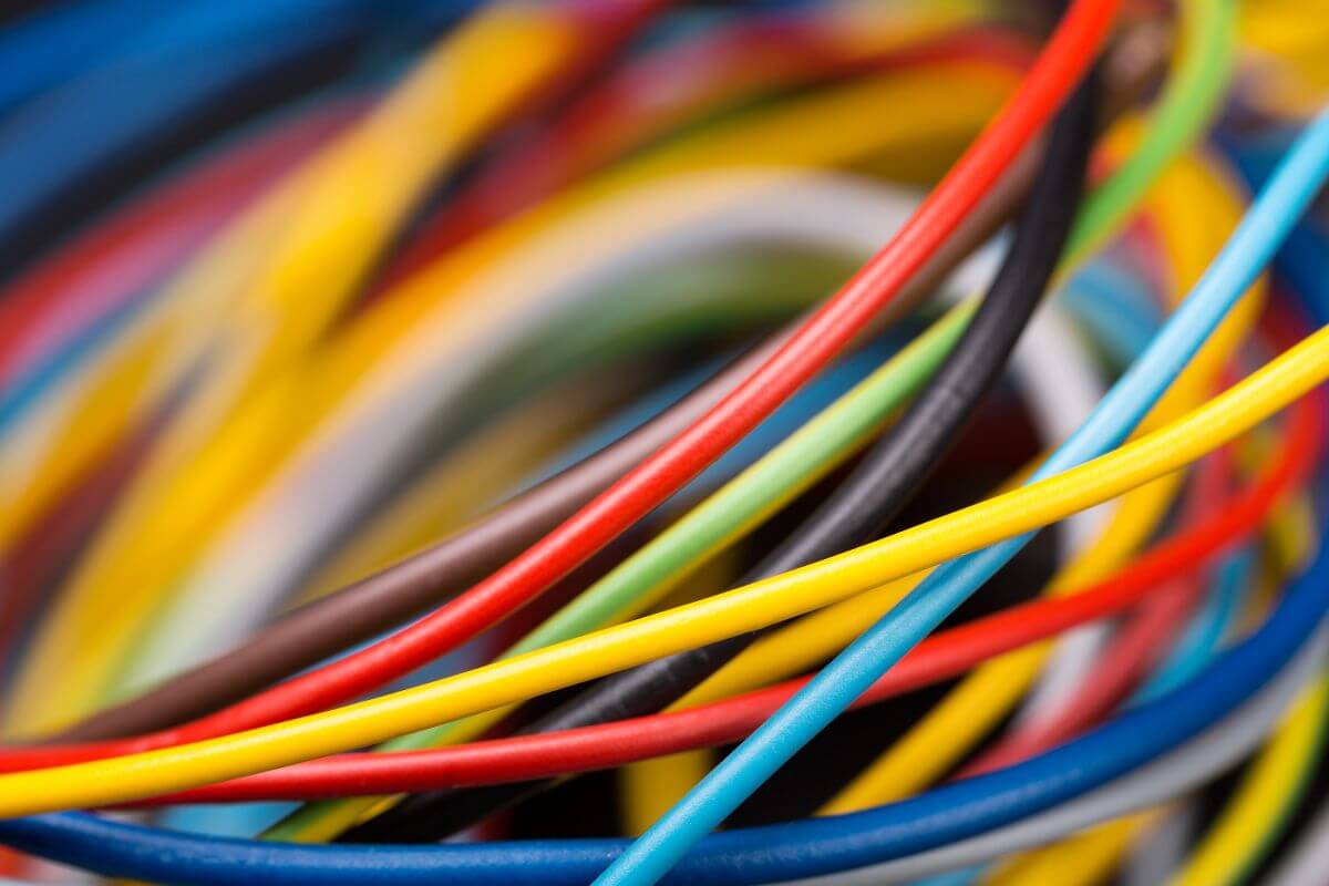 The image of colorful random cables that no longer work or belong to unused devices add unnecessary clutter.