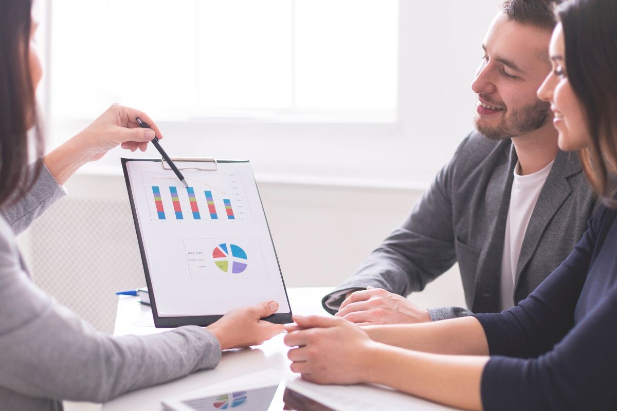 Image of financial advisor reviewing her client's financial plan.